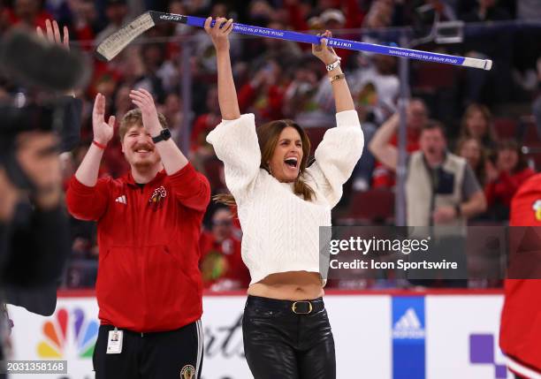 Model Cindy Crawford reacts after scoring during shoot the puck during the second intermission against the Detroit Red Wings and the Chicago...