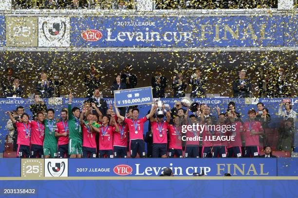 Captain Yoichiro Kakitani of Cerezo Osaka lifts the trophy at the award ceremony following the J.League YBC Levain Cup final between Cerezo Osaka and...