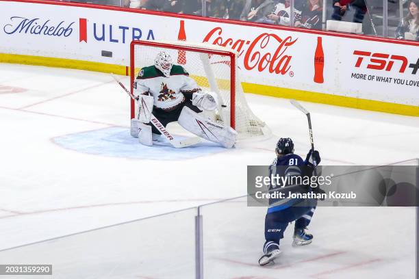 Kyle Connor of the Winnipeg Jets shoots the puck behind goaltender Connor Ingram of the Arizona Coyotes for the overtime winning goal at the Canada...
