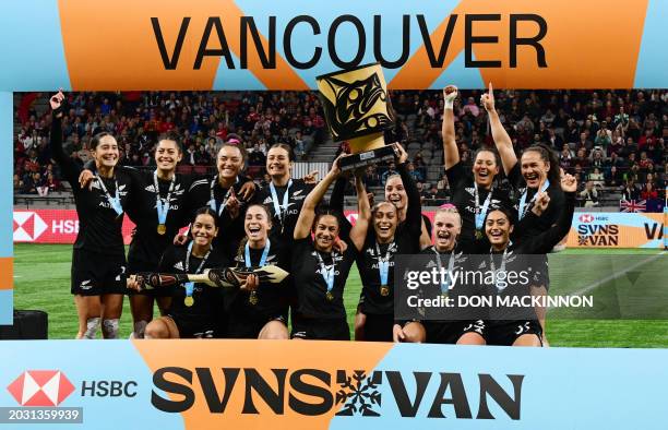 New Zealand's players celebrate with the trophy after winning the 2024 HSBC Canada Sevens women's rugby tournament at BC Place Stadium in Vancouver,...