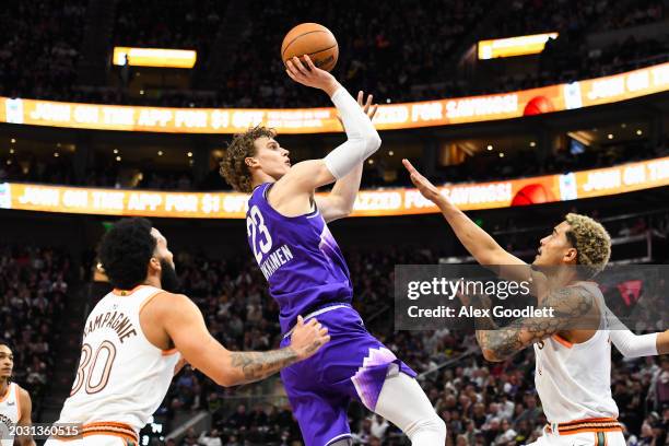 Lauri Markkanen of the Utah Jazz shoots over Jeremy Sochan of the San Antonio Spurs during the second half at Delta Center on February 25, 2024 in...