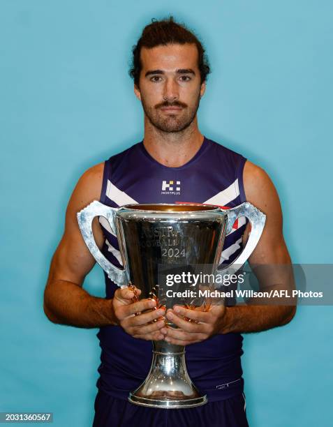 Alex Pearce of the Dockers poses for a photograph with the Premiership Cup during the 2024 AFL Captains Day at Marvel Stadium on February 26 2024 in...