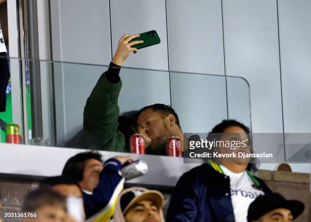 Minka Kelly and Dan Reynolds take a selfie during the soccer match between Inter Miami against the Los Angeles Galaxy at Dignity Health Sports Park...
