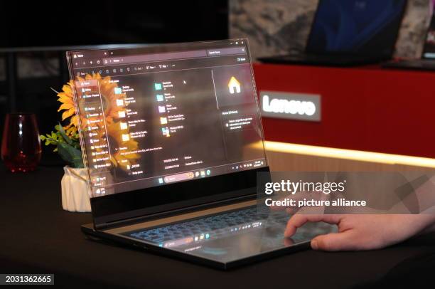 February 2024, Spain, Barcelona: A laptop with a transparent screen stands in a room in Barcelona, where computer manufacturer Lenovo presented new...