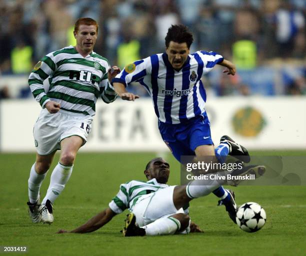 Dmitri Alenichev of FC Porto is tackled by Didier Agathe of Celtic during the UEFA Cup Final match held on May 21, 2003 at the Estadio Olimpico in...