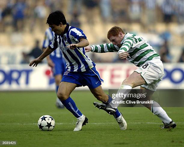 Deco of FC Porto takes the ball past Neil Lennon of Celtic during the UEFA Cup Final match held on May 21, 2003 at the Estadio Olimpico in Seville,...