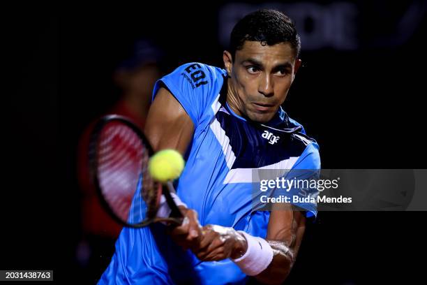 Thiago Monteiro of Brazil returns a shot to Felipe Meligeni Alves of Brazil during day four of ATP 500 Rio Open presented by Claro at Jockey Club...