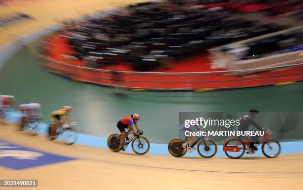 Great Britain's Victoria Pendleton , Cuba's Lisandra Guerra Rodriguez and riders follow the derny motor-pacer as they compete during the women's...