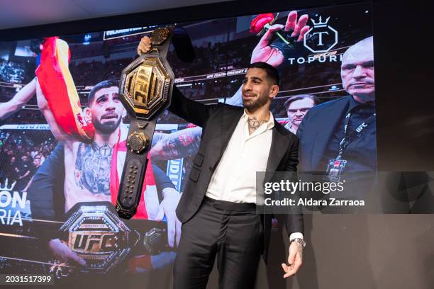 Ilia Topuria holds the championship belt during the press conference after winning the UFC Featherweight Championship at Hotel Rosewood Villa Magna...