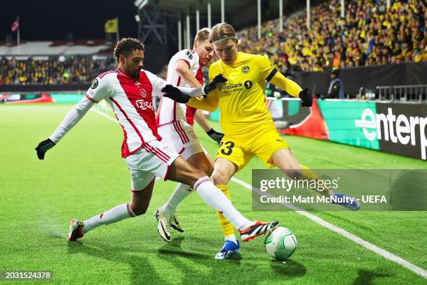 Devyne Rensch of AFC Ajax battles for possession with Jens Petter Hauge of FK Bodo/Glimt during the UEFA Europa Conference League 2023/24 knockout...