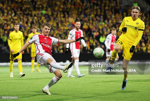 Anton Gaaei of AFC Ajax clears the ball whilst under pressure from Jens Petter Hauge of FK Bodo/Glimt during the UEFA Europa Conference League...