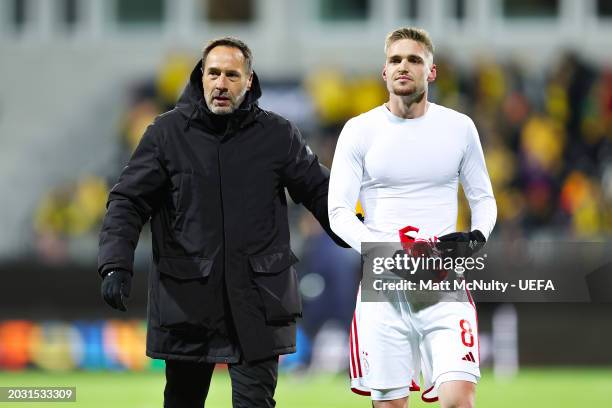 John van 't Schip, Head Coach of AFC Ajax, celebrates with Kenneth Taylor of AFC Ajax after the UEFA Europa Conference League 2023/24 knockout round...