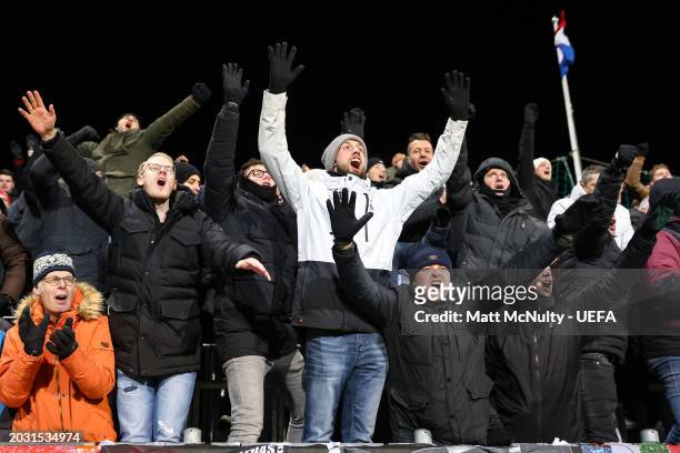 Fans of AFC Ajax celebrate victory after the UEFA Europa Conference League 2023/24 knockout round play-offs second leg match between FK Bodo/Glimt...