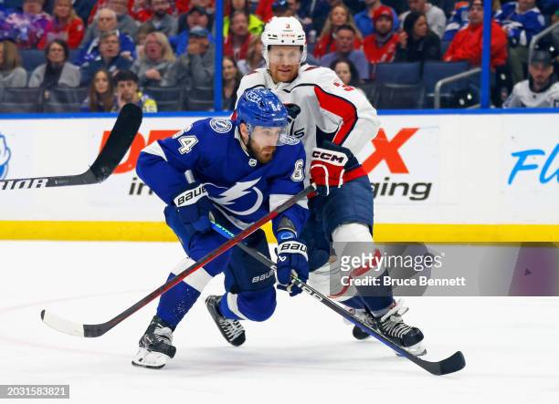 Nick Jensen of the Washington Capitals slows down Tyler Motte of the Tampa Bay Lightning during the second period at Amalie Arena on February 22,...