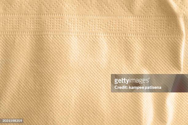 brown kitchen paper towel texture background - brown paper towel stock pictures, royalty-free photos & images