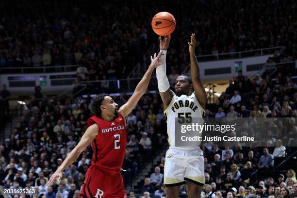 Lance Jones of the Purdue Boilermakers takes a shot over Noah Fernandes of the Rutgers Scarlet Knights during the second half at Mackey Arena on...