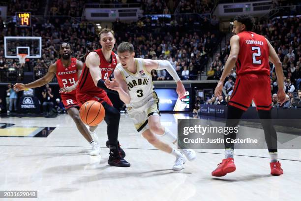 Braden Smith of the Purdue Boilermakers drives to the basket while defended by Oskar Palmquist of the Rutgers Scarlet Knights during the second half...