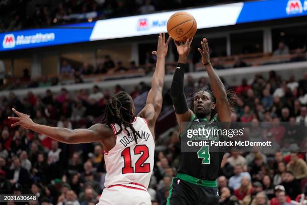 Jrue Holiday of the Boston Celtics shoots the ball against Ayo Dosunmu of the Chicago Bulls during the first half at the United Center on February...