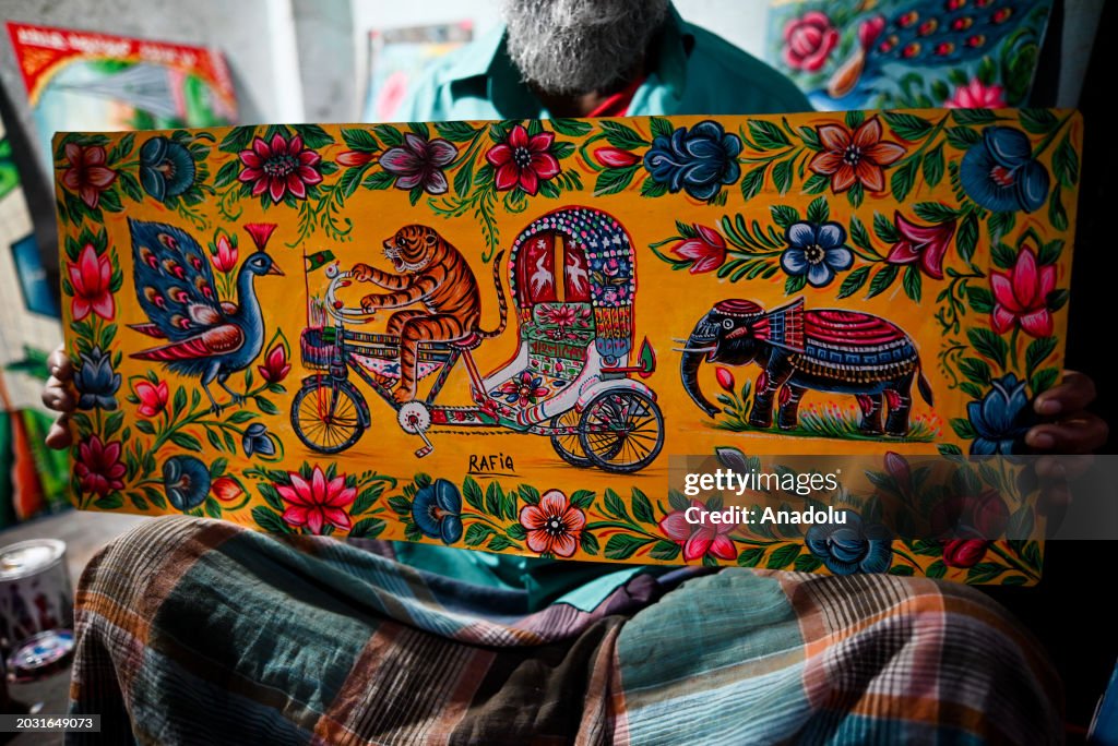 Rickshaw artist Rafiq shows his rickshaw painting at his station in ...