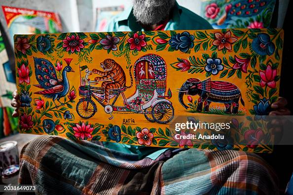 Rafiq Artist Rickshaw artist Rafiq shows his rickshaw painting at his station in ...
