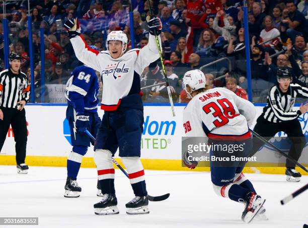 Nicolas Aube-Kubel celebrates the game winning goal by Rasmus Sandin of the Washington Capitals against the Tampa Bay Lightning at Amalie Arena on...