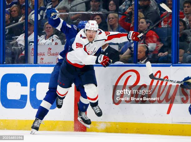 Nicholas Paul of the Tampa Bay Lightning checks Nicolas Aube-Kubel of the Washington Capitals during the third period at Amalie Arena on February 22,...