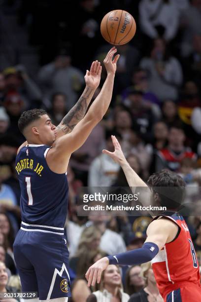 Michael Porter Jr. #1 of the Denver Nuggets puts up a shot over Deni Avdija of the Washington Wizards in the first quarter at Ball Arena on February...