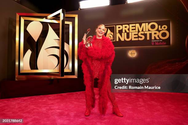 Olga Tañón poses with the Excellence Award during Univision's 36th Premio Lo Nuestro at Kaseya Center on February 22, 2024 in Miami, Florida.