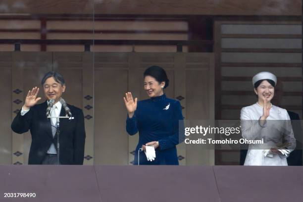 Japan's Emperor Naruhito, Empress Masako and their daughter Princess Aiko wave to well-wishers on the balcony of the Imperial Palace on February 23,...