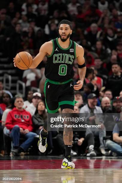 Jayson Tatum of the Boston Celtics dribbles the ball during the first half against the Chicago Bulls at the United Center on February 22, 2024 in...