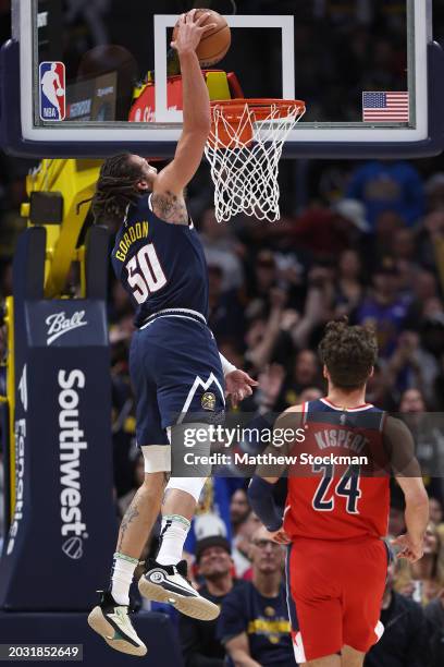 Aaron Gordon of the Denver Nuggets dunks against Corey Kispert of the Washington Wizards in the first quarter at Ball Arena on February 22, 2024 in...