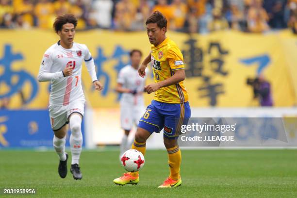 Gakuto Notsuda of Vegalta Sendai controls the ball against Ataru Esaka of Omiya Ardija during the J.League J1 match between Vegalta Sendai and Omiya...