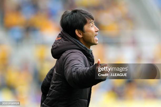 Head coach Masatada Ishii of Omiya Ardija gives the team instruction during the J.League J1 match between Vegalta Sendai and Omiya Ardija at Yurtec...