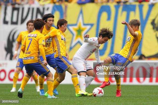 Genki Omae of Omiya Ardija competes for the ball against Vegalta Sendai defense during the J.League J1 match between Vegalta Sendai and Omiya Ardija...