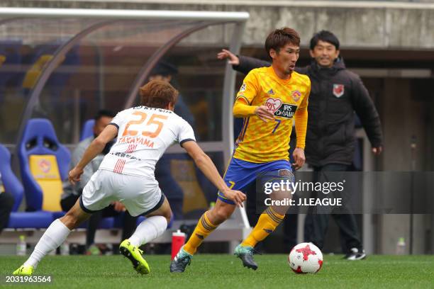 Hiroaki Okuno of Vegalta Sendai controls the ball against Kazuma Takayama of Omiya Ardija during the J.League J1 match between Vegalta Sendai and...