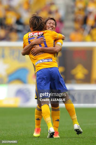 Tatsuya Masushima of Vegalta Sendai celebrates with teammate Gakuto Notsuda after scoring the team's first goal during the J.League J1 match between...