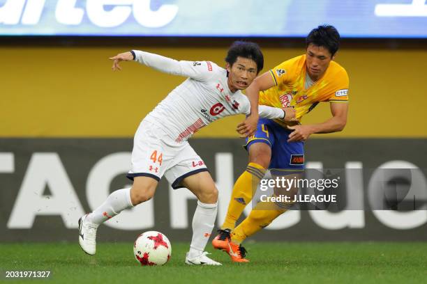 Yusuke Segawa of Omiya Ardija controls the ball against Koji Hachisuka of Vegalta Sendai during the J.League J1 match between Vegalta Sendai and...