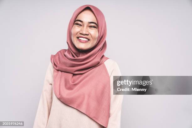 happy smiling malaysian woman with hijab studio portrait - islam stock pictures, royalty-free photos & images