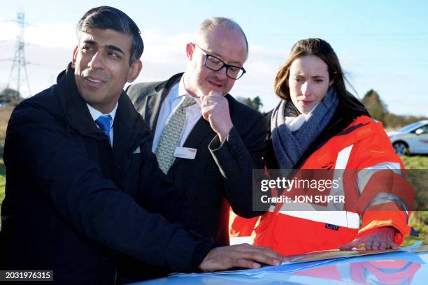 Britain's Prime Minister Rishi Sunak Chief Executive and Board member of Network Rail Andrew Haines and Principal Programme Sponsor of Network Rail...
