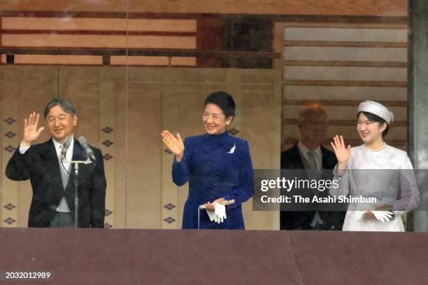 Emperor Naruhito, Empress Masako and Princess Aiko wave to well-wishers on the balcony on emperor's 64th birthday at the Imperial Palace on February...