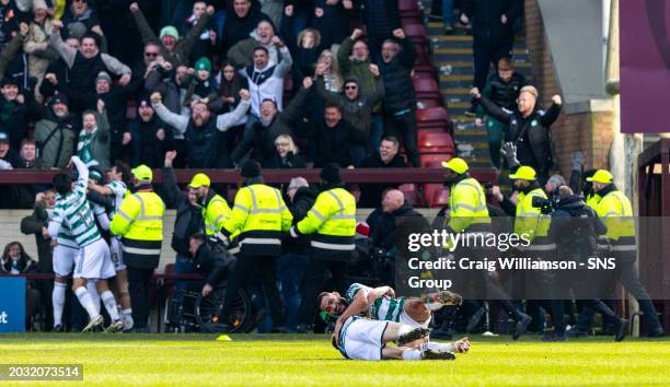 Celtic's Cameron Carter-Vickers celebrates the late winner with Alistair Johnston during a cinch Premiership match between Motherwell and Celtic at...