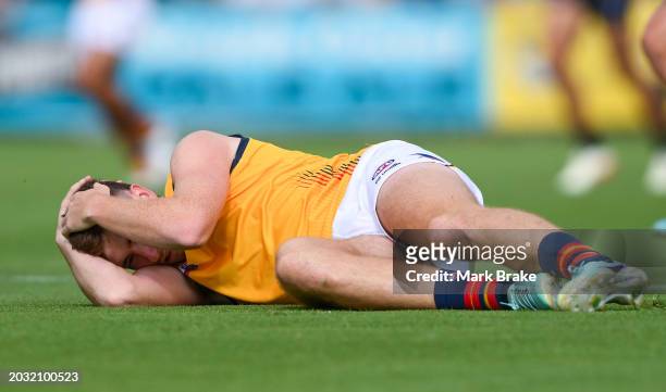 Mark Keane of the Crows reacts to tackle by Willie Rioli of the Power and Sam Powell-Pepper of the Power causing a concussion during an AFL practice...