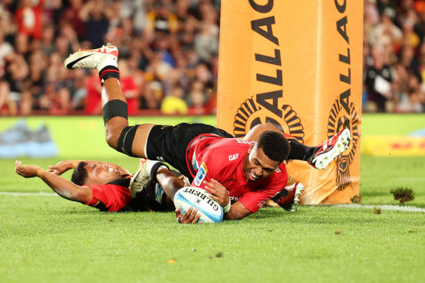 Chay Fihaki of the Crusaders scores a try during the round one Super Rugby Pacific match between Chiefs and Crusaders at FMG Stadium Waikato, on...