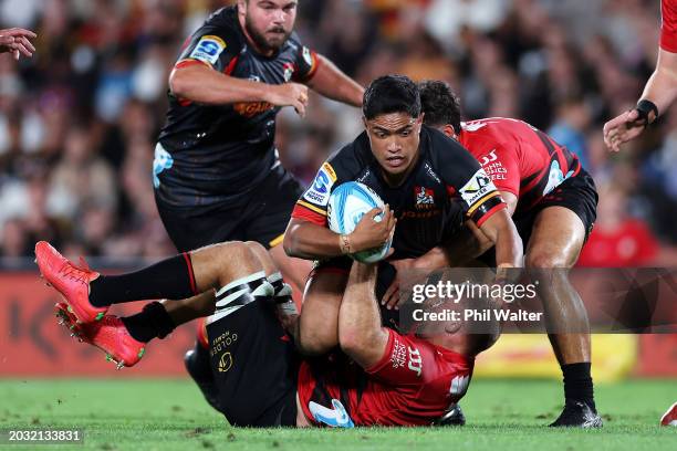 Josh Ioane of the Chiefs is tackled during the round one Super Rugby Pacific match between Chiefs and Crusaders at FMG Stadium Waikato, on February...