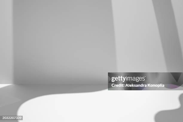 empty studio 3d exhibition background - white stage with soft natural abstract diagonal wavy shadows, architectural window light. front view, copy space. - stage light 3d stock pictures, royalty-free photos & images