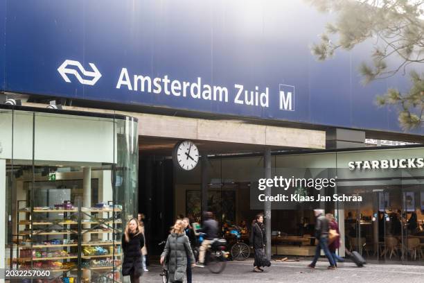 entrance to the amsterdam south centraal railway station - amsterdam zuidas stock pictures, royalty-free photos & images