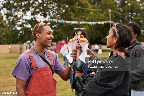 cheerful friends toasting dessert together - snack cake stock pictures, royalty-free photos & images