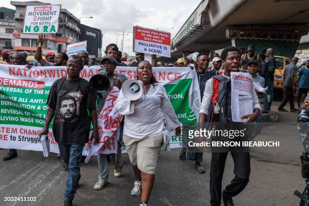 Protestors march with placards and banners during the Joint Action Front and the Coalition for Revolution nationwide protest against the government...