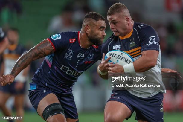 Blake Schoupp of the Brumbies is tackled by Lukhan Salakaia-Loto of the Rebels during the round one Super Rugby Pacific match between Melbourne...