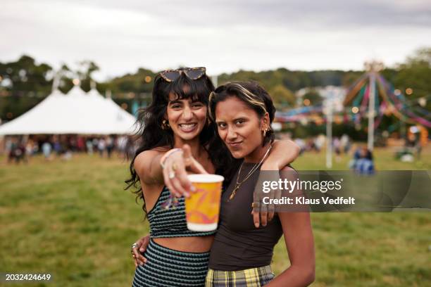 portrait of happy female friends with holding cup - food and drink sign stock pictures, royalty-free photos & images